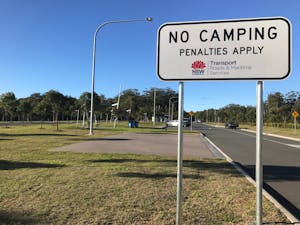 No Camping Penalties apply sign